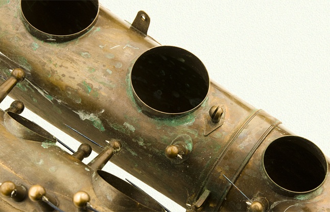 Heavy verdigris on bare brass horn
